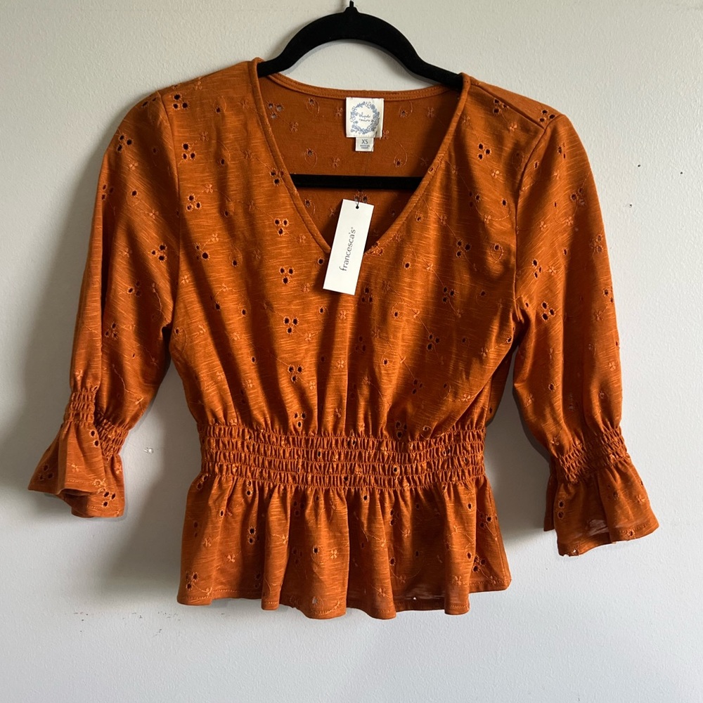 NWT Burnt Orange Peplum Eyelet Top from Francesca’s